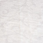 Dettaglio del tessuto di una tovaglia color tortora.